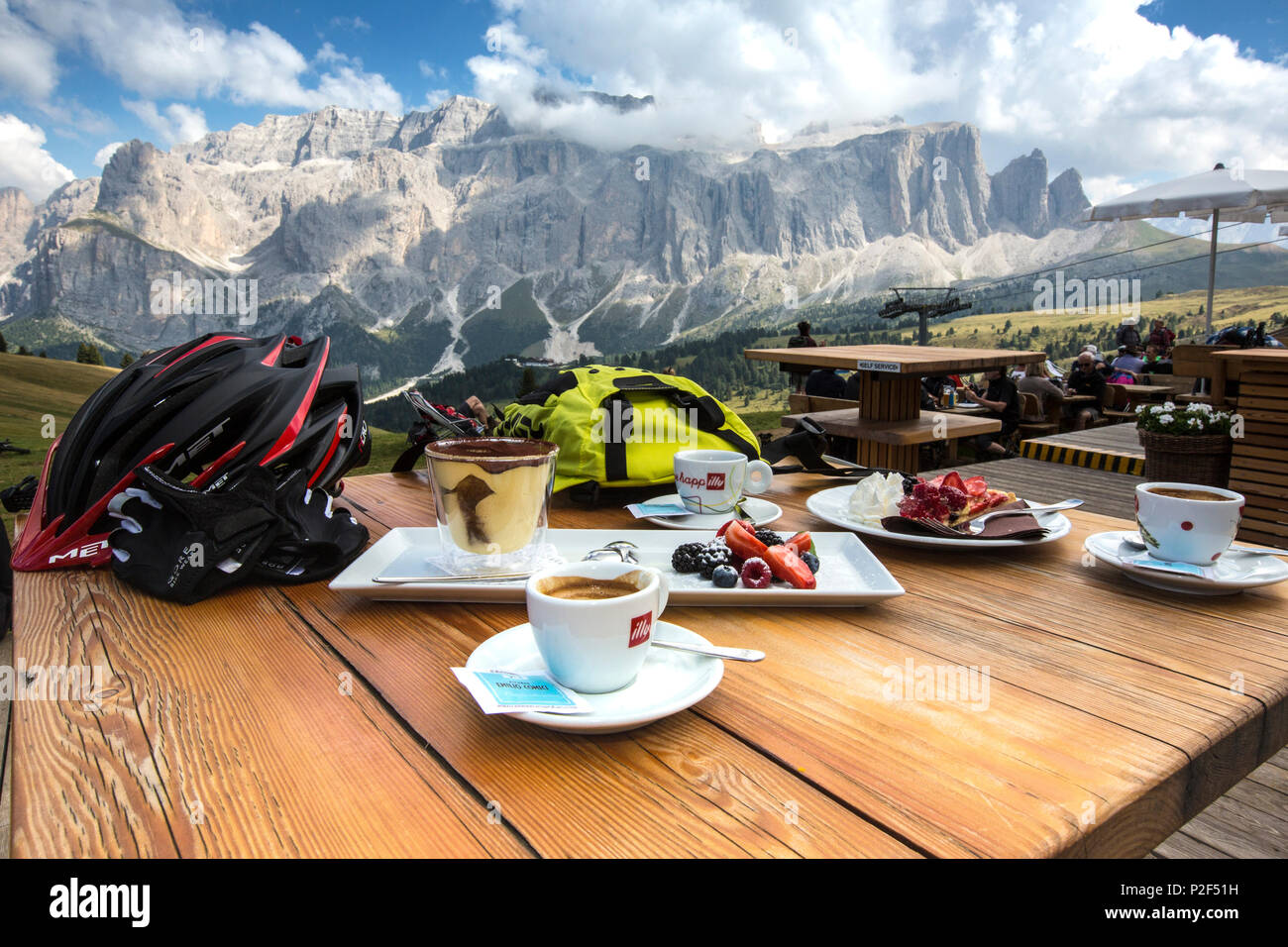 Dessert with espresso at the Emilio Comici hut at Langkofel, behind it Sella group, Trentino South Tyrol, Italy Stock Photo