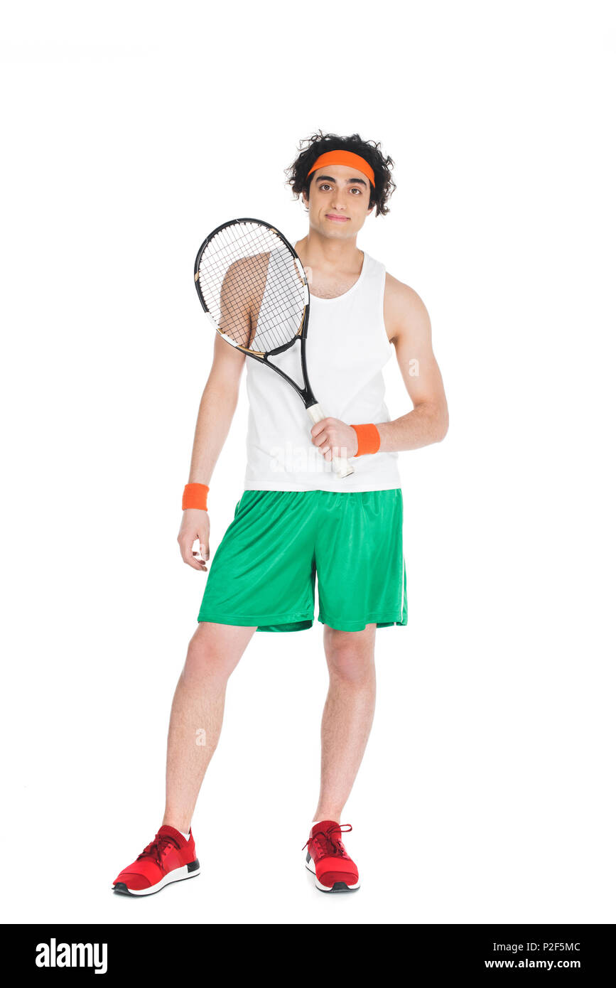Thin tennis player in headband standing with racket isolated on white ...