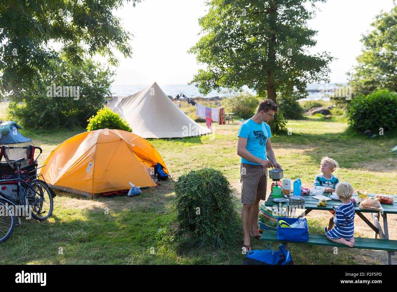 Family eating breakfirst at Hullehavn Camping, Baltic sea, MR, Bornholm, Svaneke, Denmark, Europe Stock Photo