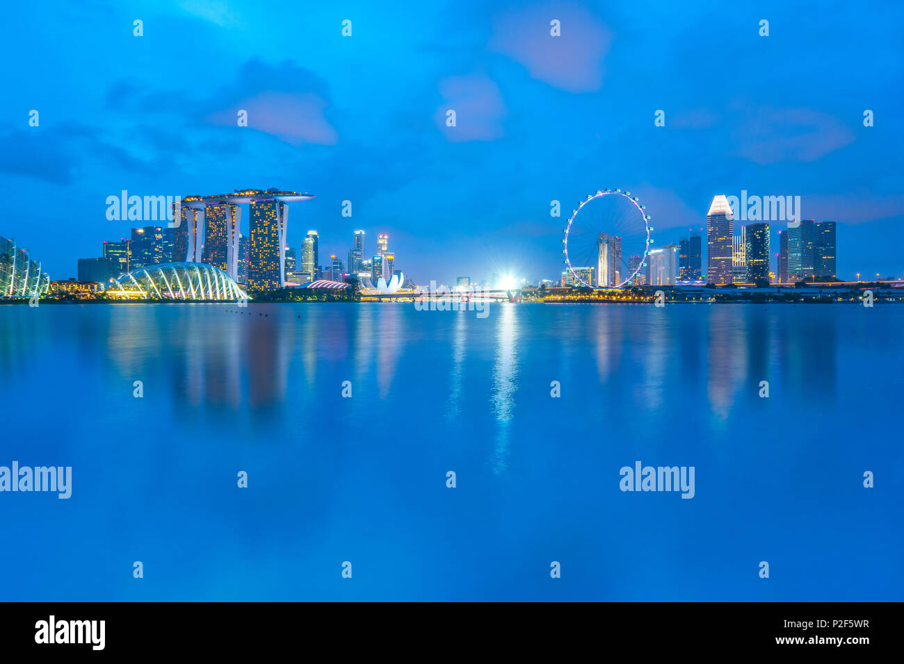 Singapore city skyline with Marina Bay at night. Stock Photo