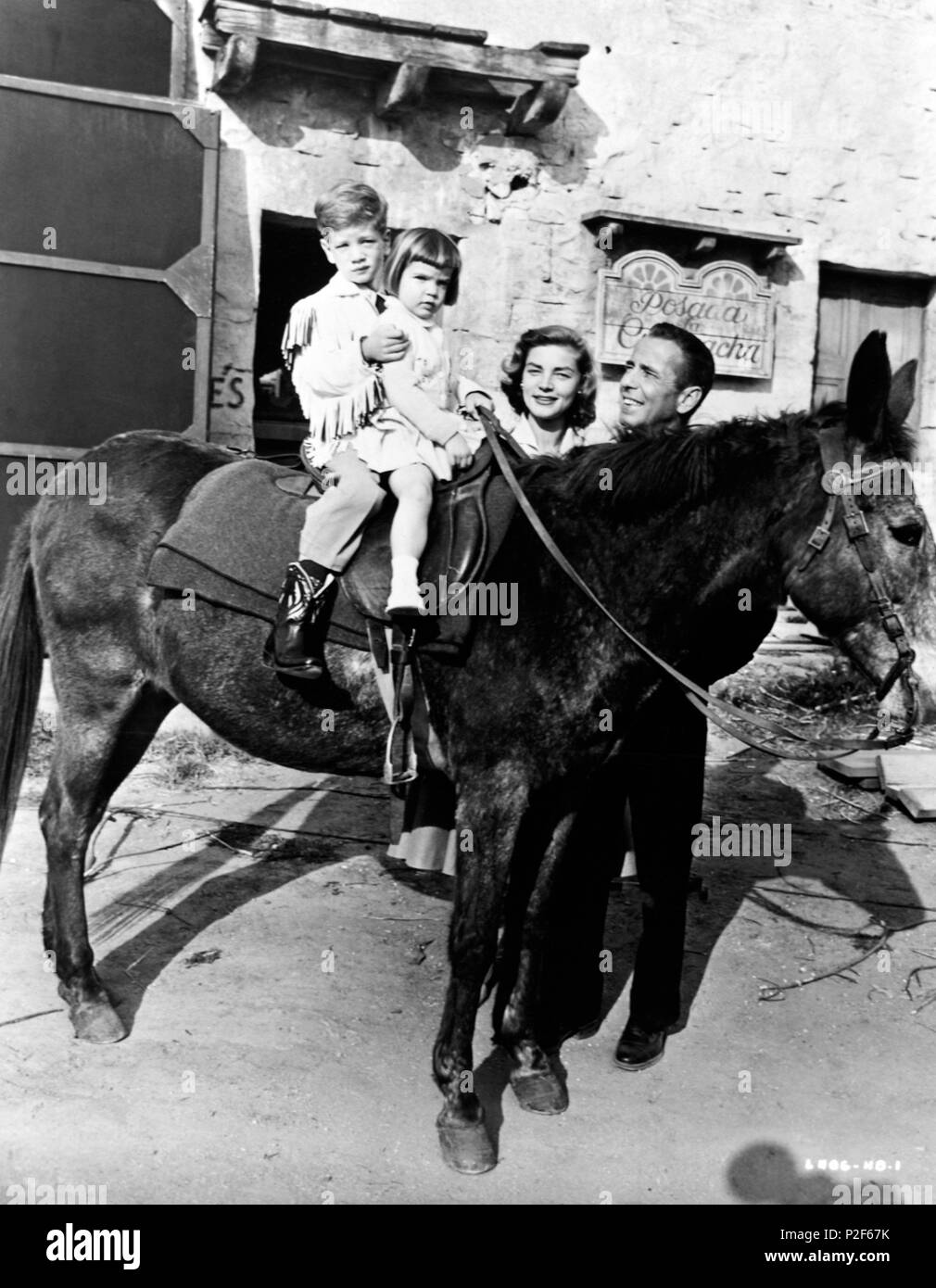 Description: 1955. Lauren Bacall and sons, Stephen an Leslie, during a visit to Humphey Bogart in China, while he was filming 'Left Hand of God'..  Stars: LAUREN BACALL; HUMPHREY BOGART. Stock Photo