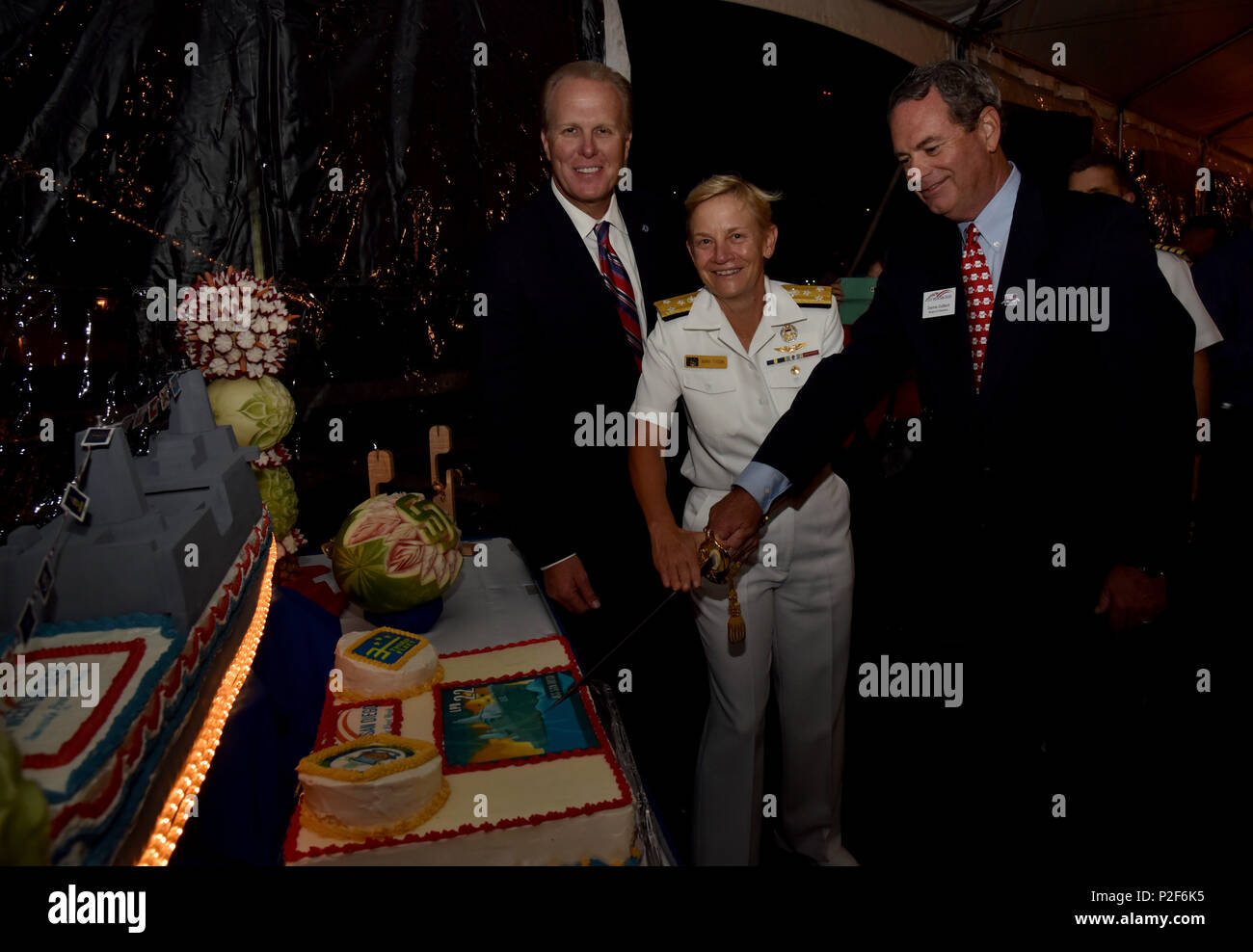 160912-N-HK946-139 SAN DIEGO (Sept. 12, 2016) – San Diego Mayor Kevin Faulconer, Vice Adm. Nora Tyson, commander, U.S. 3rd Fleet, and Dennis DuBard, president of the Fleet Week San Diego Board of Directors, cut a cake during a reception aboard amphibious transport dock ship USS San Diego (LPD 22), during San Diego Fleet Week 2016. Fleet week offers the public an opportunity to meet Sailors, Marines, and members of the Coast Guard and gain a better understanding of how the sea services support the national defense of the United States and freedom of the seas. (U.S. Navy photo by Mass Communicat Stock Photo