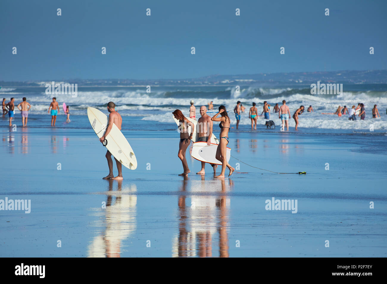 Surfers and bathers on the beach of Canggu, Bali, Indonesia Stock Photo