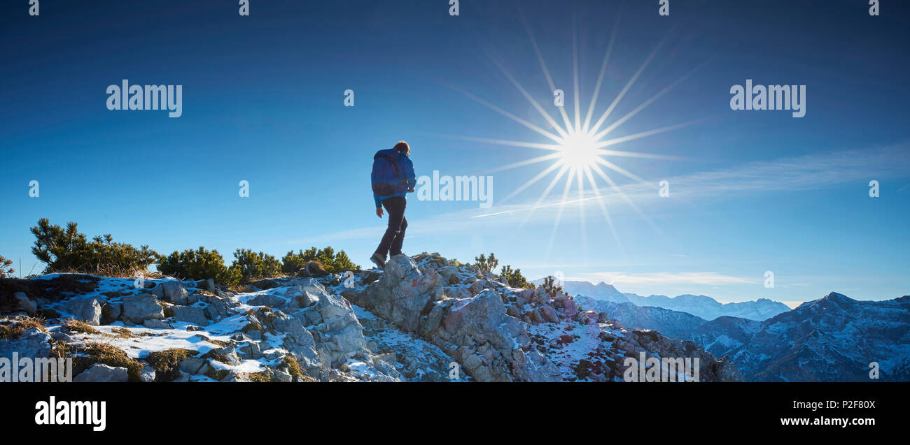 Hikers in the late Autumn at the summit of the Scheinbergspitze, Ammergauer Alps, Germany Stock Photo