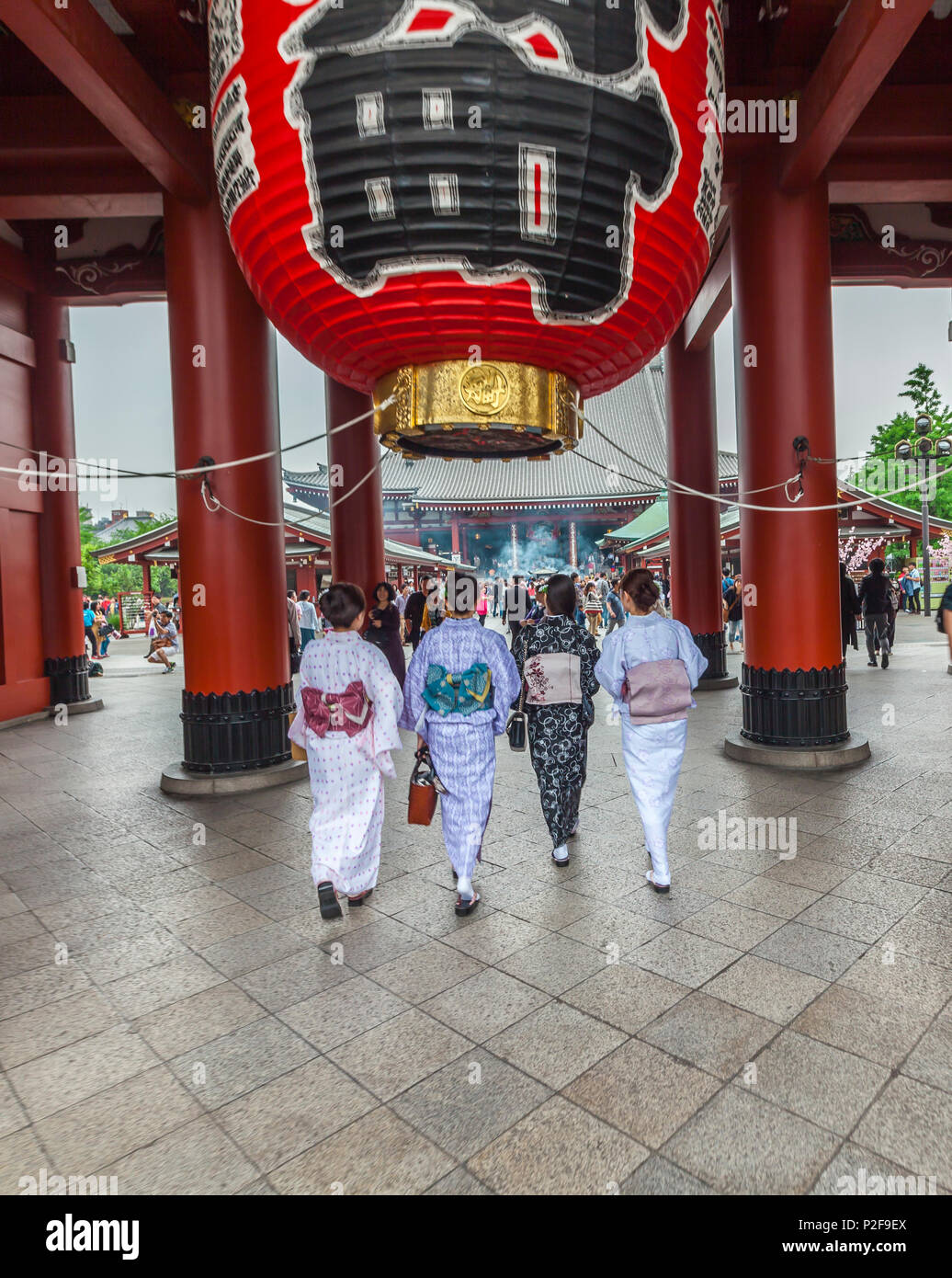 Four Japanese women wearing kimono and walking in front of Senso-ji Temple in Asakusa, Taito-ku, Tokyo, Japan Stock Photo