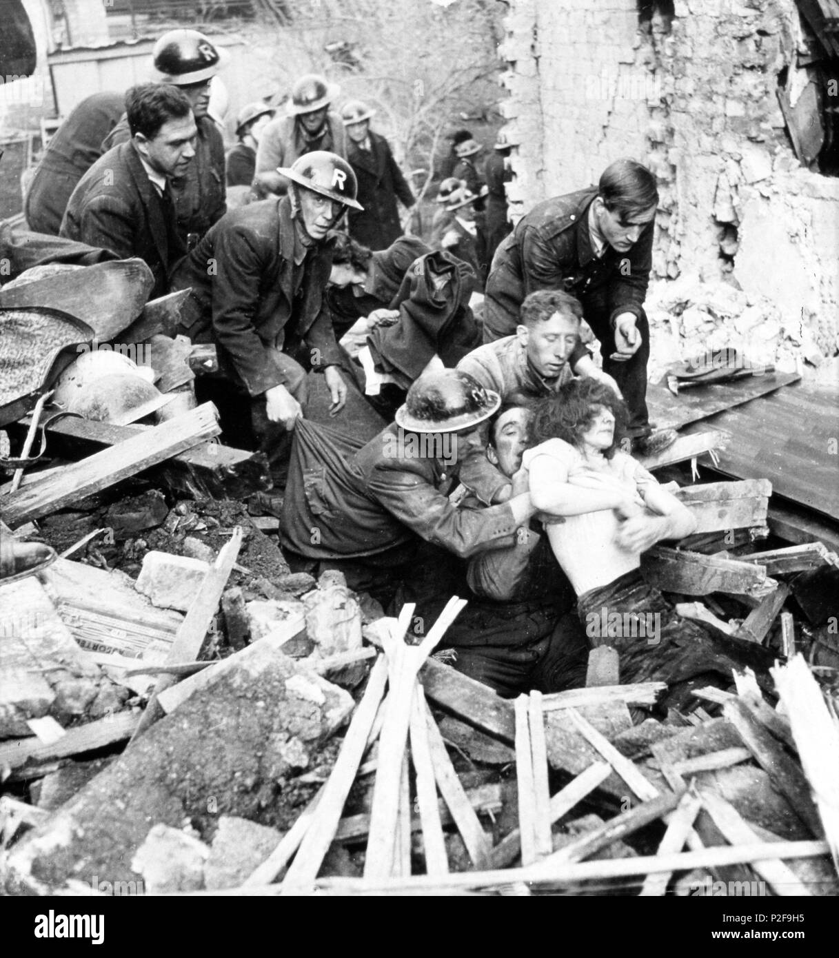 Western front: Battle of Britain. London Blitz.1940. After hours of toil the rescue squad saves a life London, England. Stock Photo