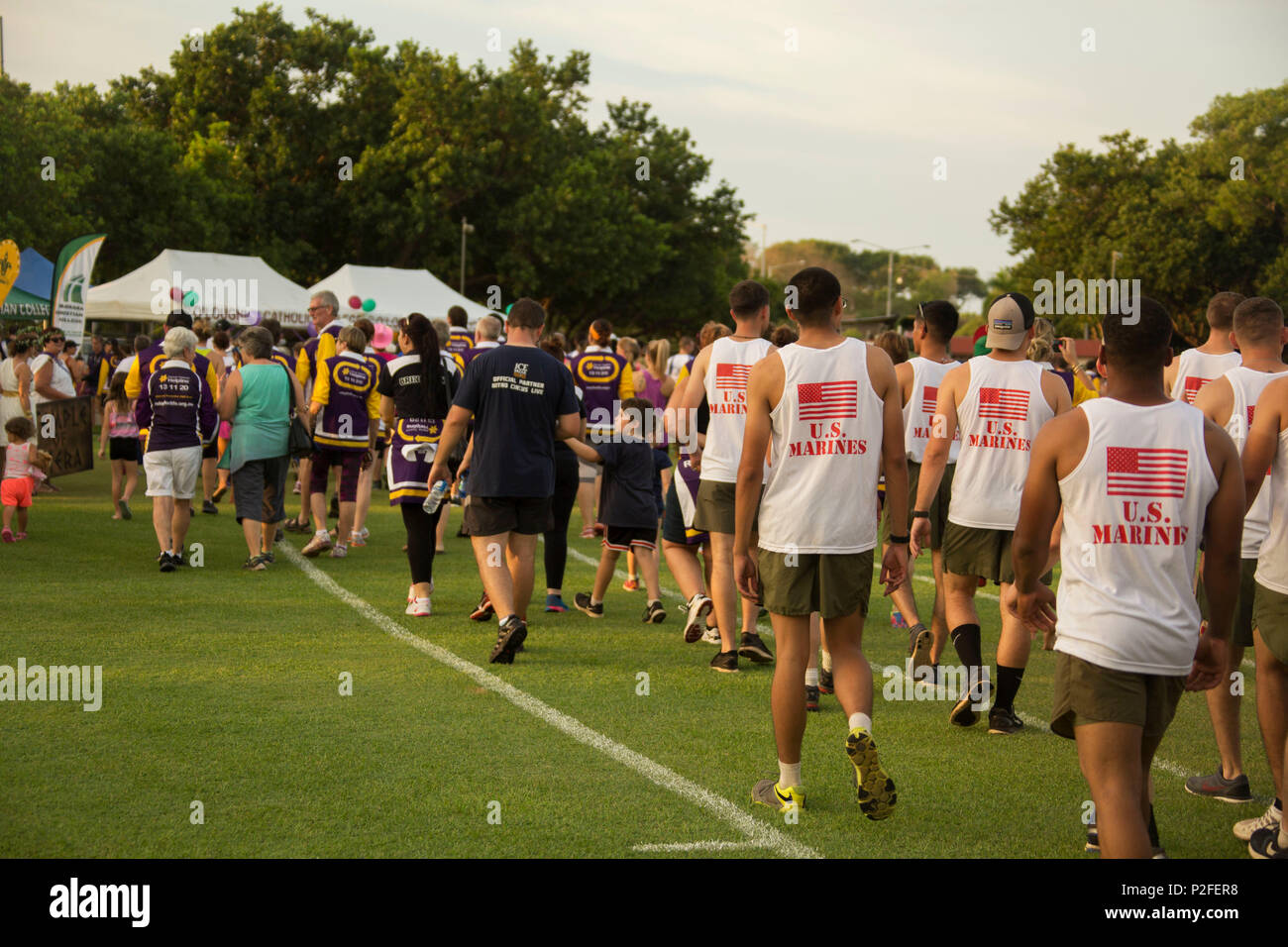 Marines with Marine Rotational Force – Darwin participate in the Relay for Life at the Gardens Oval in Darwin, Northern Territory, Australia, Sept. 16, 2016. The Marines ran for 12 consecutive hours during this event to support the local community and cancer awareness. (U.S. Marine Corps photo by Sgt. Carlos Cruz Jr.) Stock Photo