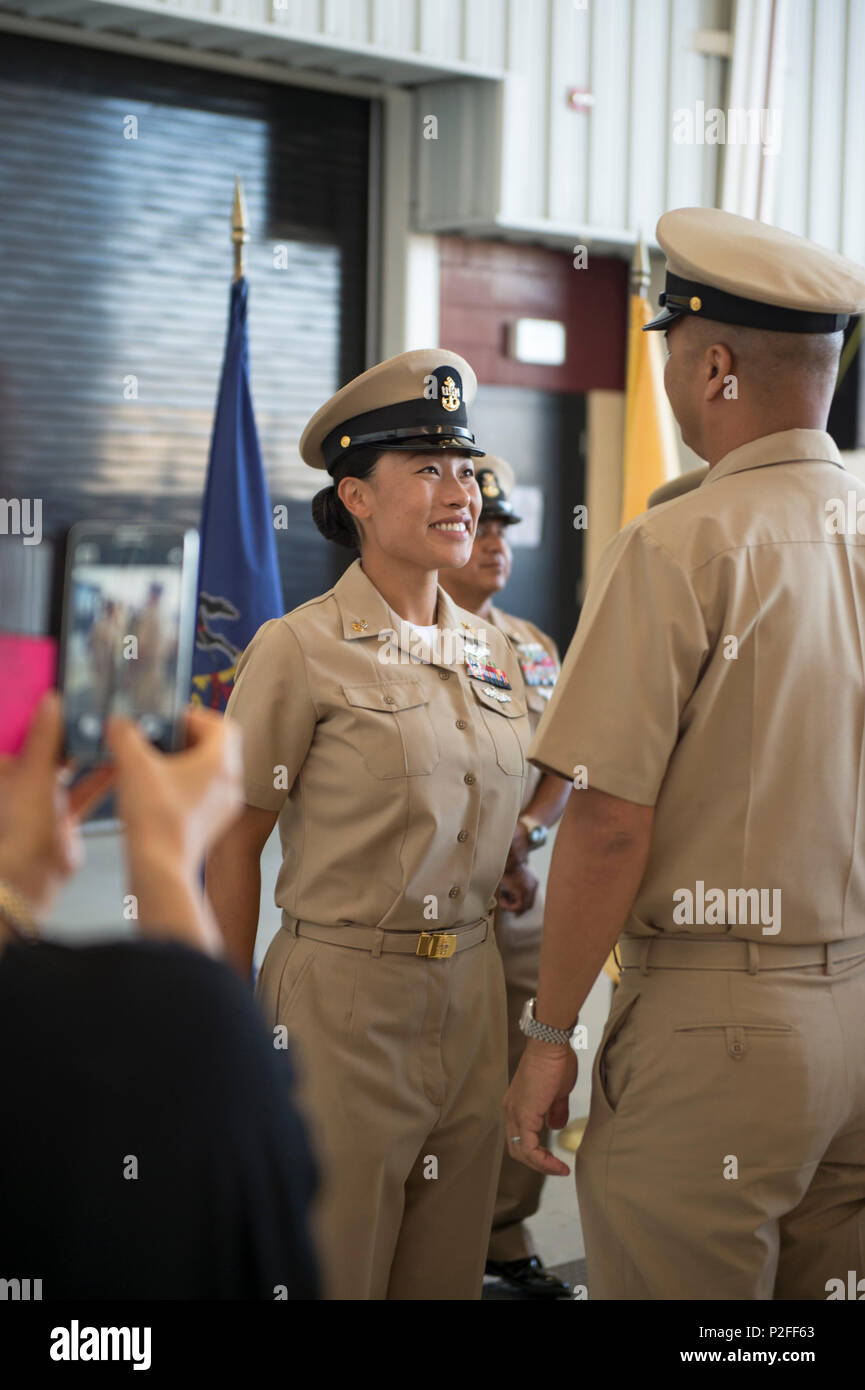 https://c8.alamy.com/comp/P2FF63/160917-n-ns216-132-san-diego-sept-17-2016-chief-information-systems-technician-janice-kook-attached-to-navy-operational-support-center-san-diego-from-fairfax-virginia-is-congratulated-by-her-mentor-after-receiving-her-combination-cover-during-the-fy-17-chief-petty-officer-pinning-ceremony-for-class-123-held-at-fleet-logistics-support-squadron-five-seven-naval-air-station-north-island-fifty-four-reserve-sailors-from-various-san-diego-based-commands-donned-khaki-uniforms-and-combination-covers-for-the-first-time-after-completing-cpo-365-phase-ii-us-navy-photo-by-mass-communicati-P2FF63.jpg