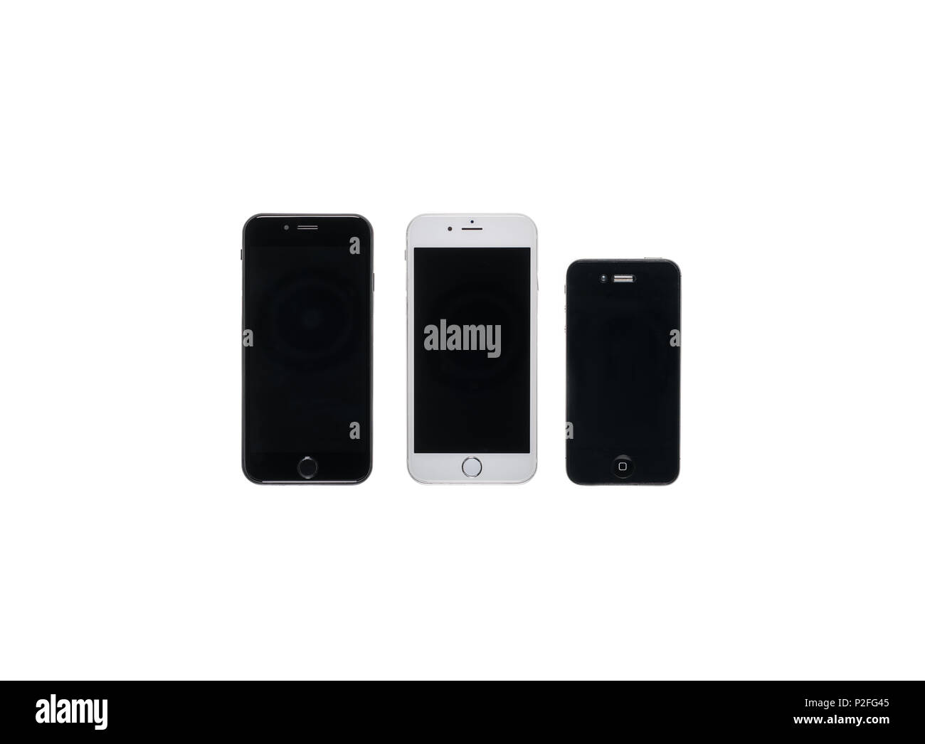 Three smartphones of various sizes with black screens isolated on white Stock Photo