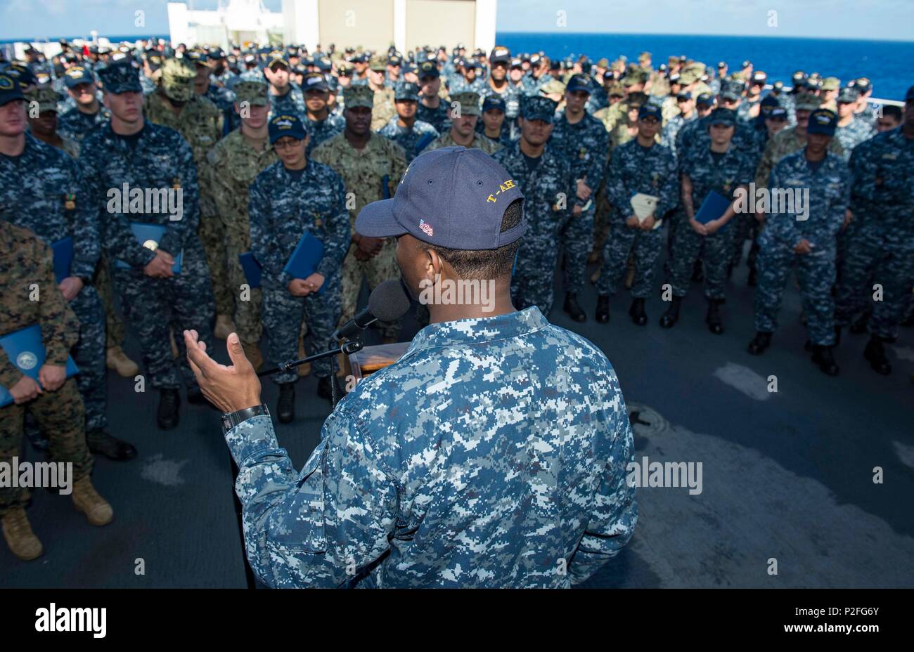160917-N-QW941-214 PACIFIC OCEAN (Sept. 17, 2016) Medical Treatment Facility, USNS Mercy (T-AH 19), Command Master Chief Dedrick Walker, from England, Arkansas, addresses the crew after an awards ceremony on the flight deck. Deployed in support of Pacific Partnership 2016, Mercy is sailing to her homeport of San Diego. (U.S. Navy photo by Mass Communication Specialist 3rd Class Trevor Kohlrus/Released) Stock Photo