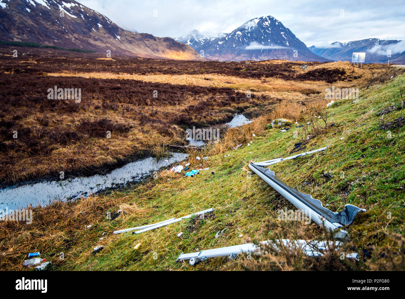 Car parts, caravan awning, plastic and metal dumped in Glen Coe - polluting a world class site of natural beauty in the Highlands of Scotland Stock Photo