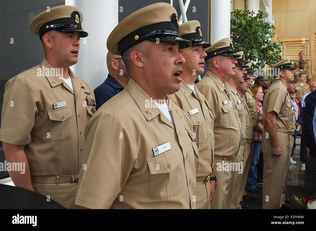 Chiefs sing Anchors Aweigh during a chief petty officer pinning