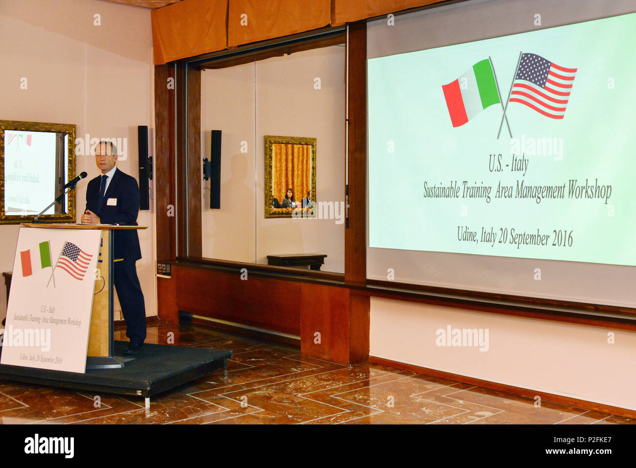 Nate Whelan , U.S. Army Europe Integrated Training Area Management (ITAM) Program Manager, Training Support Activity Europe, 7th Army Training Command, addresses members of United States Army, the Italian Army, Italian authorities and Italian Civilians from 12th Infrastructure Command, on Sustainable Training Area Management Programs, in Udine, Italy, 20 Sept. 2016. (U.S. Army photo by Visual Information Specialist Paolo Bovo/Released) Stock Photo