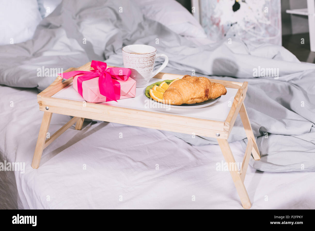 tray with breakfast and present box on bed Stock Photo Alamy