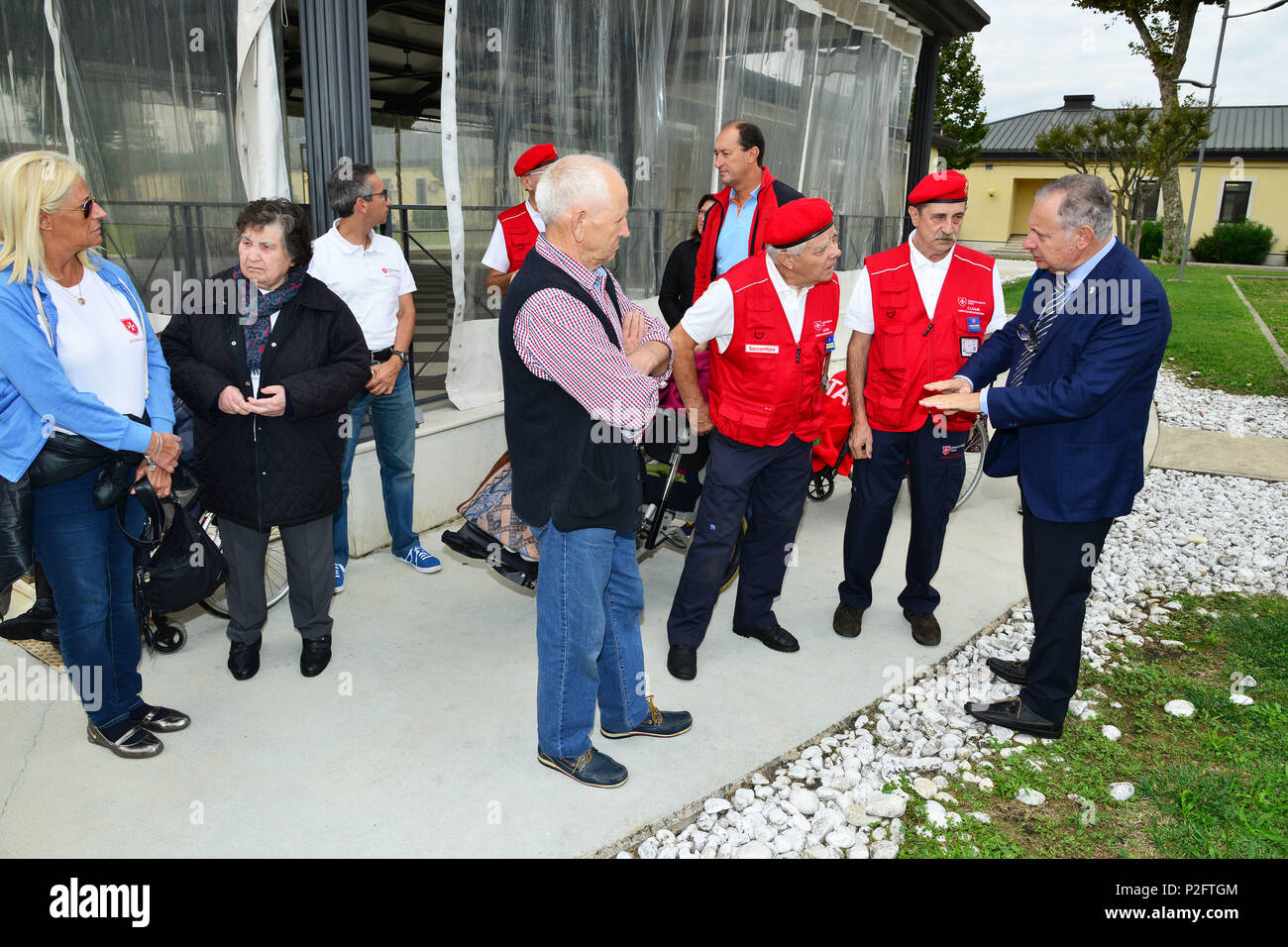 Ivano Trevisanutto, Chief Training Support Center Italy (right), discusses with Delegation of Sovereign Military Order of Malta, during the visit at caserma Ederle, 22 Sept. 2016, Vicenza, Italy. The Sovereign Military Order of Malta (SMOM) or Order of Malta, is a Roman Catholic  Religious Order traditionally of military, chivalrous and noble nature for defense of Catholic faith and assistance to the poor. (U.S. Army photo by Visual Information Specialist Paolo Bovo/Released) Stock Photo