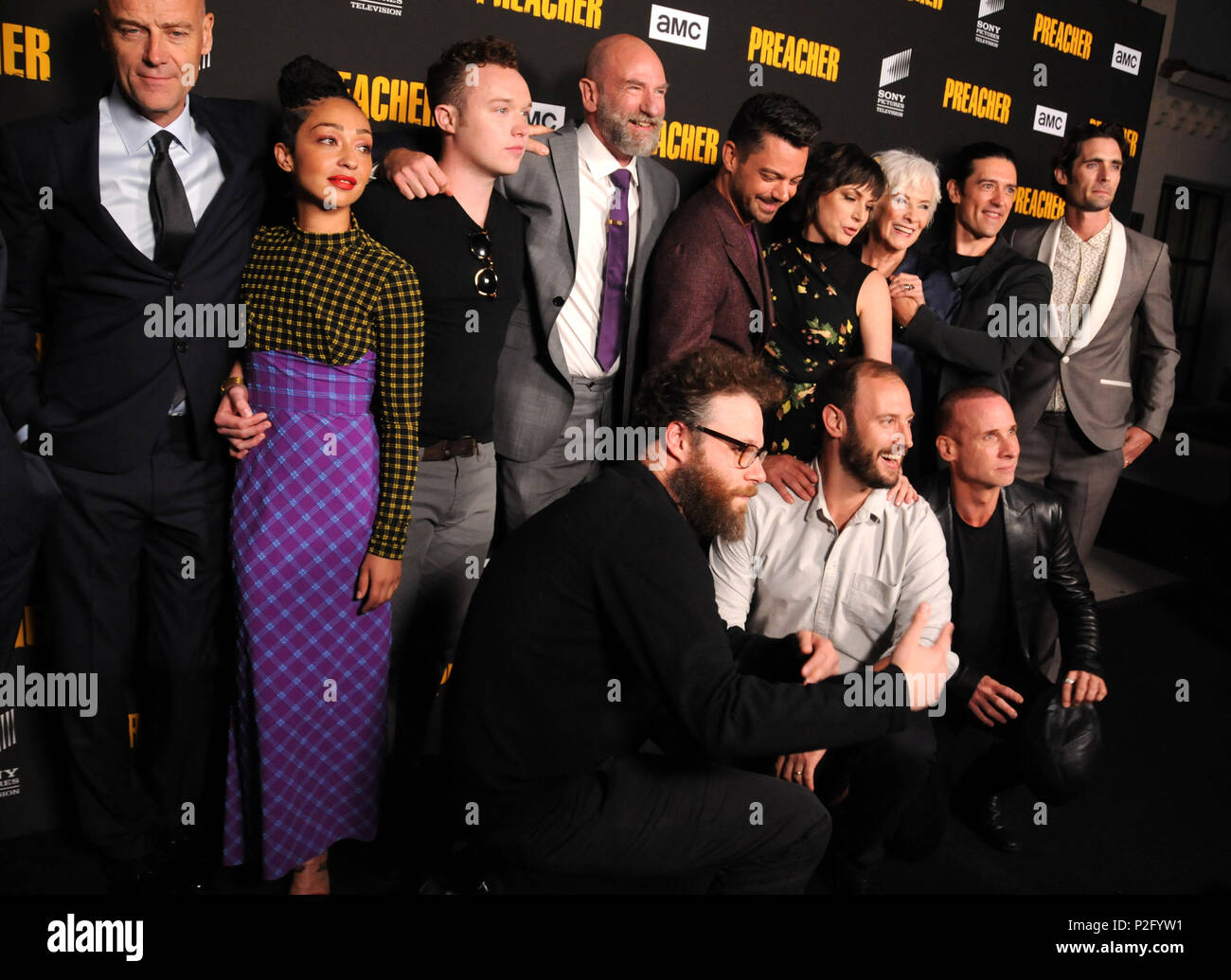 LOS ANGELES, CA - JUNE 14: (L-R) Actor Pip Torrens, actress Ruth Negga, actors Ian Colletti, Graham McTavish, Dominic Cooper, Julie Ann Emery, Betty Buckley, Adam Croasdell, Tyson Ritter and Colin Cunningham and executive producers Seth Rogen and Evan Goldberg (front)  attend AMC's 'Preacher' Season 3 Premiere Party on June 14, 2018 at The Hearth and Hound in Los Angeles, California. Photo by Barry King/Alamy Live News Stock Photo