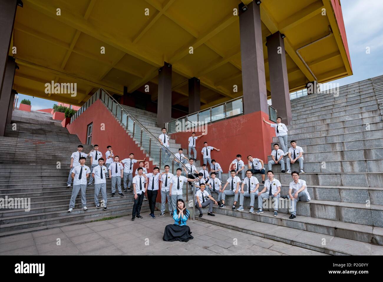 Jinzhong, Jinzhong, China. 14th June, 2018. Jinzhong, CHINA-14th June 2018: About 40 male graduates and only one female graduate poses for graduation photos at Shanxi Agricultural University in Jinzhong, north China's Shanxi Province, June 15th, 2018. Credit: SIPA Asia/ZUMA Wire/Alamy Live News Stock Photo