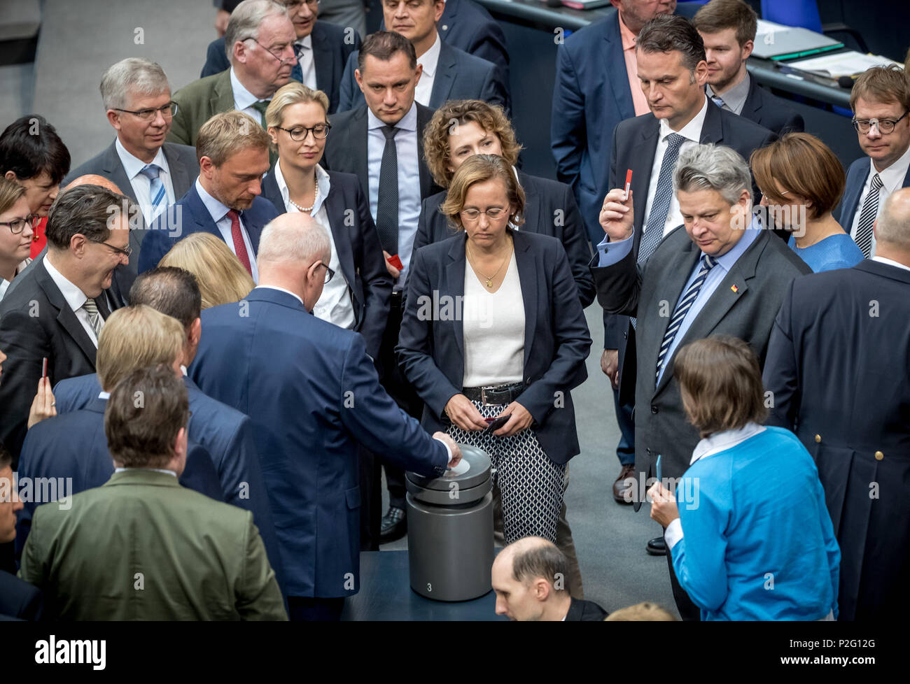 15 June 2018, Germany, Berlin: Federal deputies casting their ballots during a roll call vote on party finances in the plenary hall of the Bundestag. The German Bundestag discussed in its meeting, among other things, party finances and reunion of migant families. Photo: Michael Kappeler/dpa Stock Photo