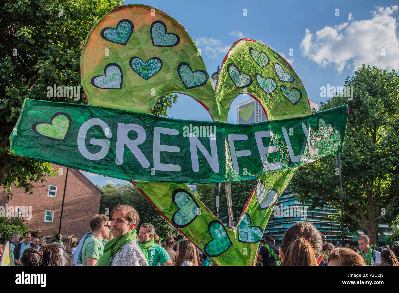 London, UK. 14th June 2018. The march prepares to set off in teh shadow of the tower - The first anniversary of the Grenfell Tower Disaster Credit: Guy Bell/Alamy Live News Stock Photo