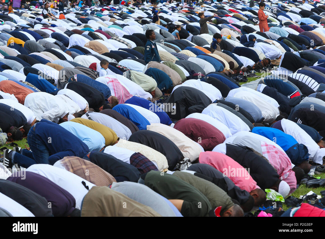 Moslem or Muslim men praying outside in Eid, Birmingham UK Stock Photo