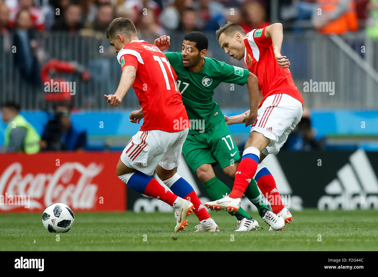 Moscow, Russia. 14th June 2018. Roman Zobnin of Russia, Taisir Al-Jassim of Saudi Arabia and Denis Cheryshev of Russia during the 2018 FIFA World Cup Group A match between Russia and Saudi Arabia at Luzhniki Stadium on June 14th 2018 in Moscow, Russia. Credit: PHC Images/Alamy Live News Stock Photo