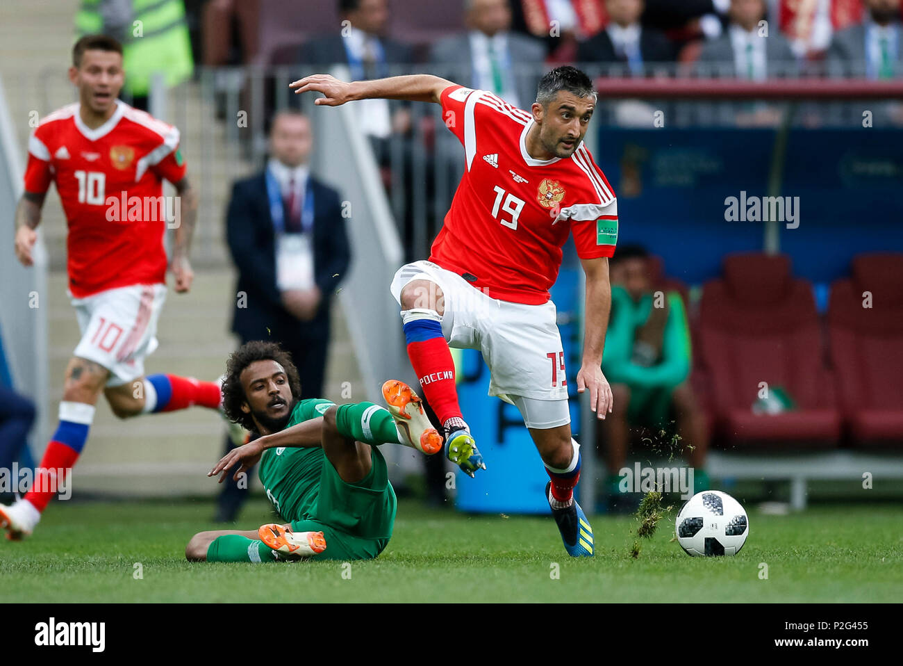 Moscow, Russia. 14th June 2018. Yasser Al-Shahrani of Saudi Arabia and Aleksandr Samedov of Russia during the 2018 FIFA World Cup Group A match between Russia and Saudi Arabia at Luzhniki Stadium on June 14th 2018 in Moscow, Russia. Credit: PHC Images/Alamy Live News Stock Photo