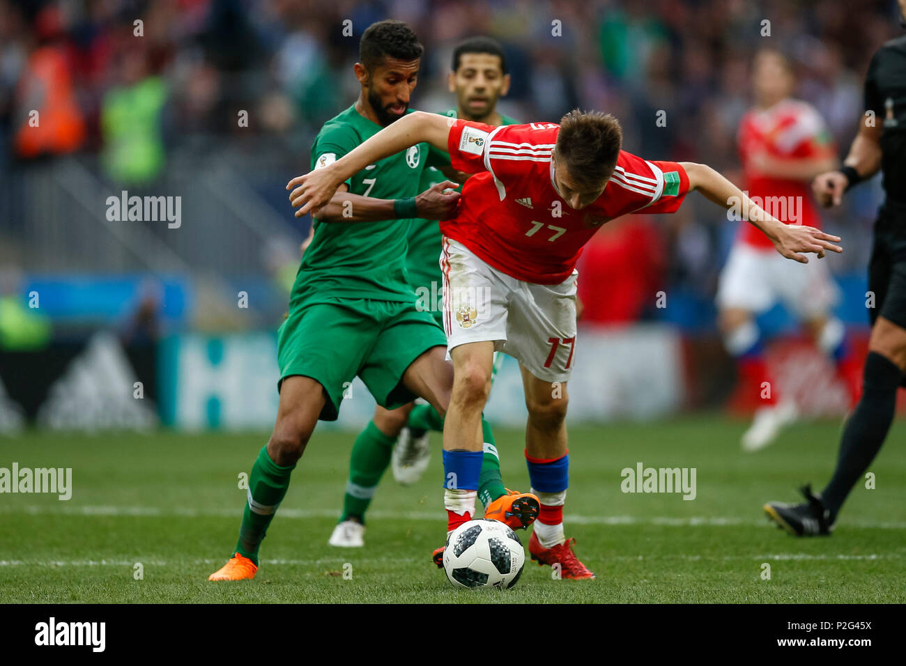 Moscow, Russia. 14th June 2018. Salman Al-Faraj of Saudi Arabia and Aleksandr Golovin of Russia during the 2018 FIFA World Cup Group A match between Russia and Saudi Arabia at Luzhniki Stadium on June 14th 2018 in Moscow, Russia. Credit: PHC Images/Alamy Live News Stock Photo