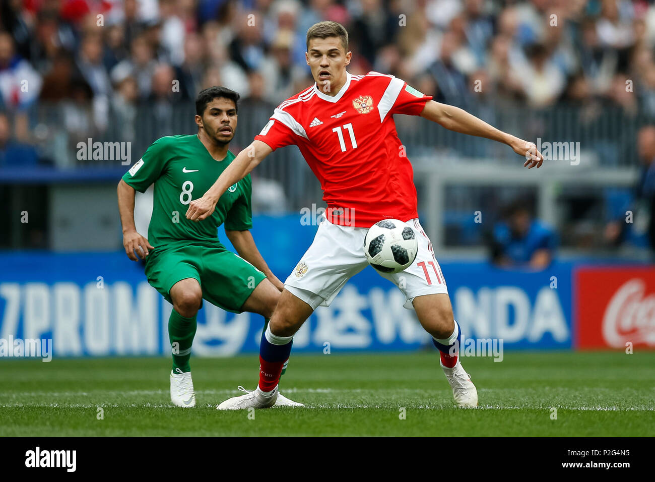 Moscow, Russia. 14th June 2018. Yahya Al-Shehri of Saudi Arabia and Roman Zobnin of Russia during the 2018 FIFA World Cup Group A match between Russia and Saudi Arabia at Luzhniki Stadium on June 14th 2018 in Moscow, Russia. Credit: PHC Images/Alamy Live News Stock Photo