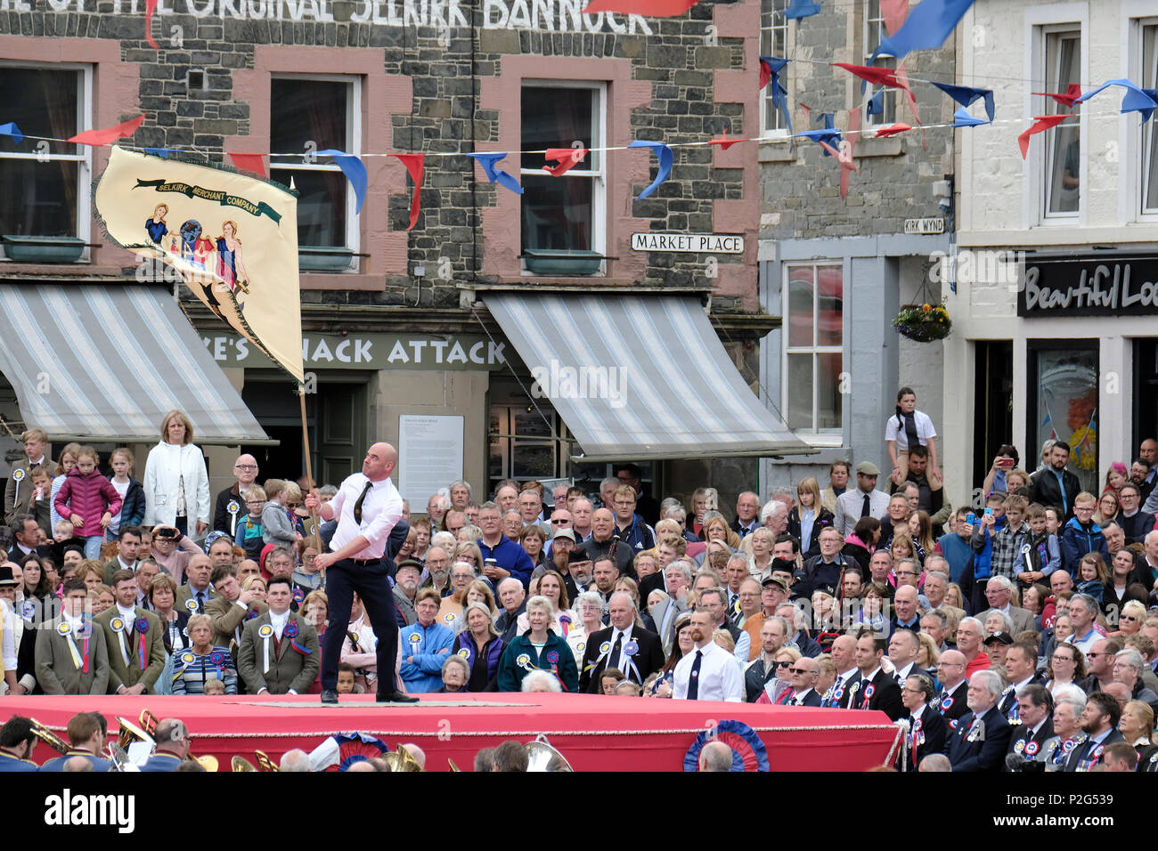 Selkirk, UK. 15th Jun, 2018. Selkirk Common Riding - Casting of the Colours  Selkirk Merchant Company - Stuart Davidson casts the Merchant Company Flag  at the end of the morning Riding Of