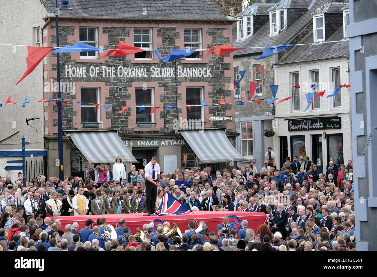 Selkirk, UK. 15th Jun, 2018. Selkirk Common Riding - Casting of the Colours  Selkirk Merchant Company - Stuart Davidson casts the Merchant Company Flag  at the end of the morning Riding Of