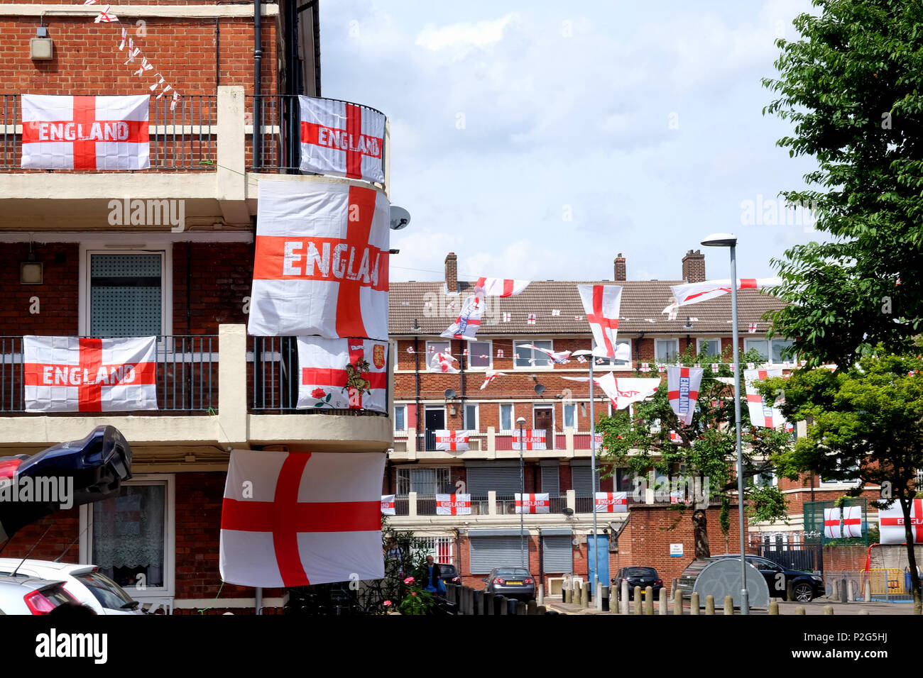 Bermondsey, UK. 15th Jun, 2018. Residents of the Kirby estate in Bermondsey fly their flags for the world cup. Predominantly England flags are interspersed with a Colombian, Polish, Portugese and French flag on this freindly estate in South London Credit: Rachel Megawhat/Alamy Live News Stock Photo