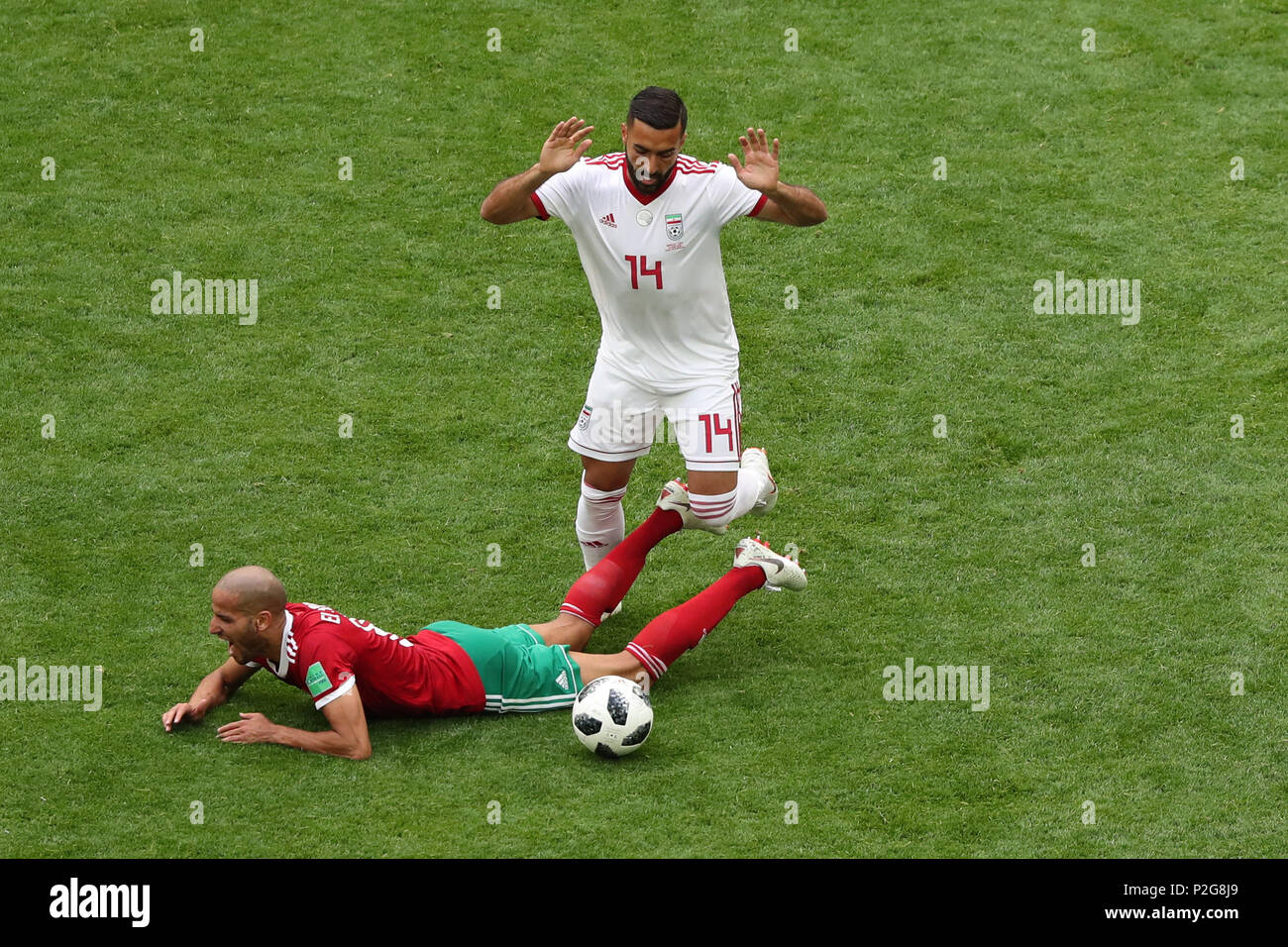 Saint Petersburg, Russia. 15th June, 2018. Iran's Saman Ghoddos (R) in action against Morocco's Morocco's Karim El Ahmadi during the FIFA World Cup 2018 Group B soccer match between Iran and Morocco at the Saint Petersburg Stadium, in Saint Petersburg, Russia, 15 June 2018. Credit: Saeid Zareian/dpa/Alamy Live News Stock Photo
