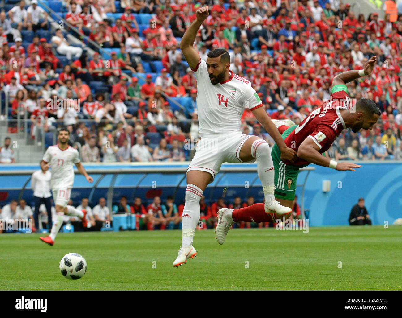 Sochi, Russia. 15th Jun, 2018. Russia, St. Petersburg, on June 15, 2018. 2018 FIFA World Cup Russia. The match of the group stage of the FIFA World Cup - 2018 between national teams of Morocco and Iran. In the picture: (from left to right) player of Iran national team GHODDOS Saman and player of Morocco national team Medhi Benatia. (Photo: Andrey Pronin/Fotoarena) Stock Photo