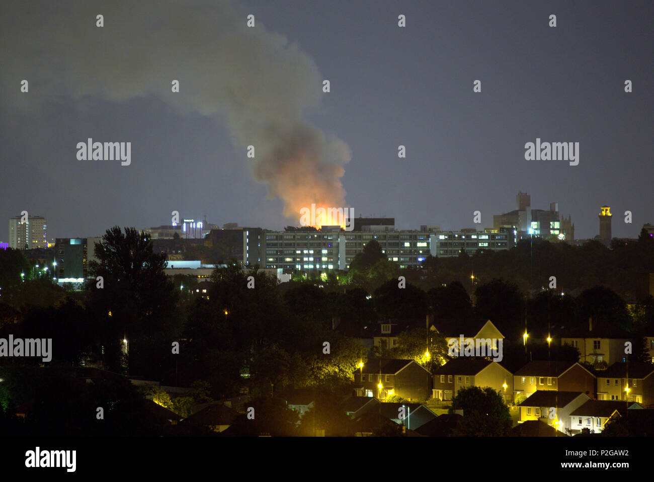 Glasgow, Scotland, UK 15th June, 2018. Glasgow school of art is on fire again on the 150th anniversary of the architects birth huge flames can be seen seven miles away and a huge plume of smoke over the city must see the end for it this time. Credit: gerard ferry/Alamy Live News Stock Photo