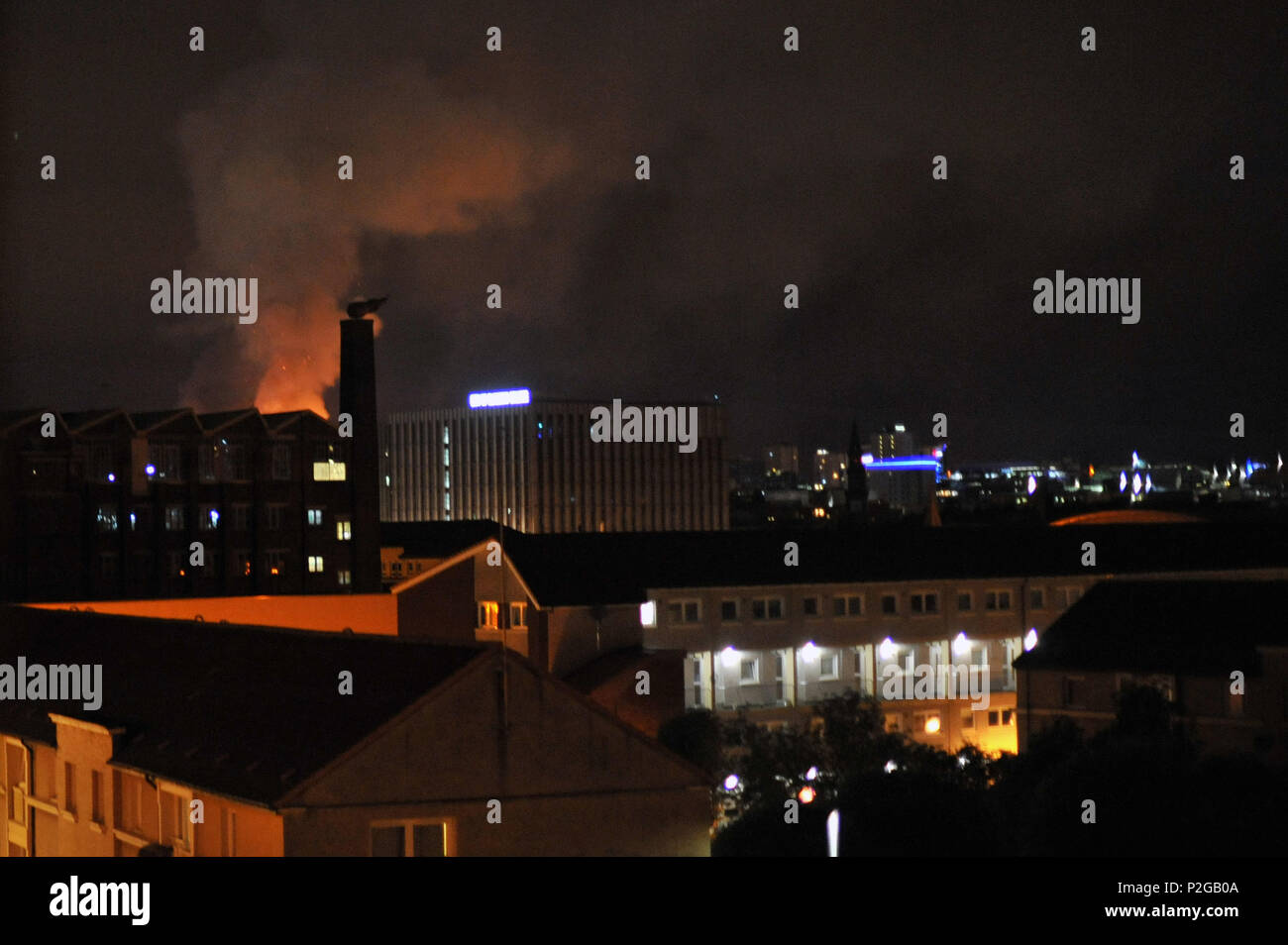 Glasgow, Scotland, UK. 16th Jun, 2018. The Glasgow School of Art is ablaze for the second time in four years. Flames can be seen across the city, these from two miles away in the Gorbals. Credit: Tony Clerkson/Alamy Live News Stock Photo