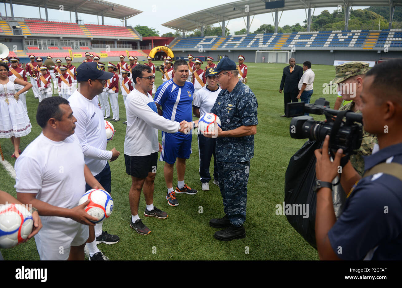 PANAMA CITY, Panama (Sept. 20, 2016) - Rear Adm. Robert Greene, Deputy Commander, U.S. Naval Forces Southern Command, gives UNITAS partner nations gift of soccer balls during a day of sports at the Estadio Maracaná de Panamá soccer stadium. UNITAS is an annual multi-national exercise that focuses on strengthening our existing regional partnerships and encourages establishing new relationships through the exchange of maritime mission-focused knowledge and expertise throughout the exercise. (U.S. Navy Photo by Mass Communication Specialist 1st Class Jacob Sippel/RELEASED) Stock Photo