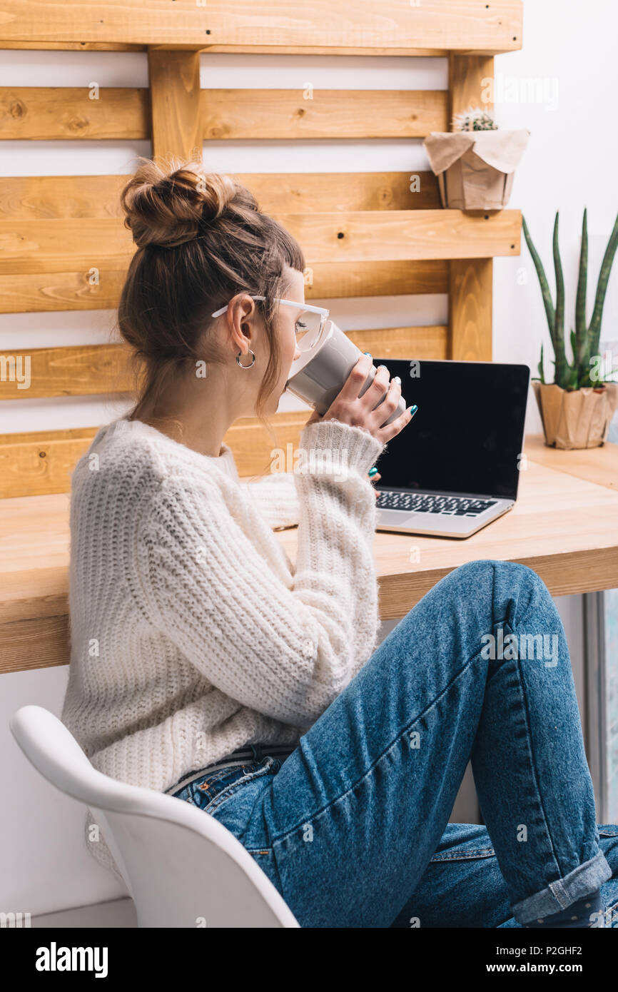 office worker sitting on chair and drinking tea Stock Photo - Alamy