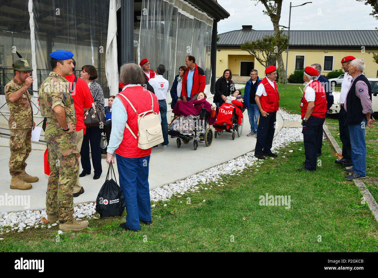 The Delegation of Sovereign Military Order of Malta, the Italian Army and members of the American Red Cross, during the visit at caserma Ederle, 22 Sept. 2016, Vicenza, Italy. The Sovereign Military Order of Malta (SMOM) or Order of Malta, is a Roman Catholic Religious Order traditionally of military, chivalrous and noble nature for defense of Catholic faith and assistance to the poor. (U.S. Army photo by Visual Information Specialist Paolo Bovo/Released) Stock Photo