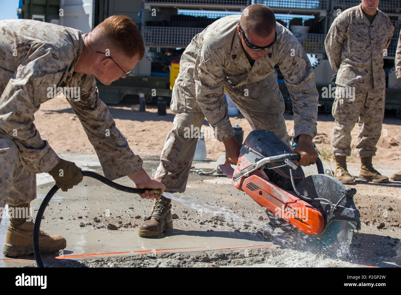 U.S. Marine Corps Sgt. Justin Sneary, right, a combat engineer with