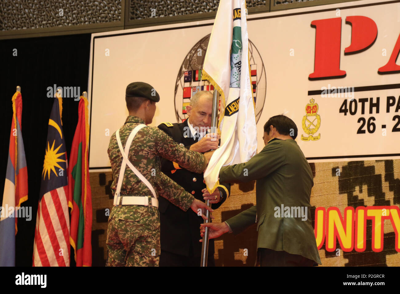 U.S. Army Gen. Robert B. Brown, Commander, U.S. Army Pacific and Lt. Gen. Dato’ Sri Zulkiple, Field Commander West, Malaysian Army post the Pacific Armies Management Seminar Flag during the opening ceremony for PAMS 2016, in Kuala Lumpur, Malaysia, Sept. 26. PAMS is an annual multinational military seminar providing a forum for senior level ground force officers from regional ground forces and security forces to meet, exchange views and discuss professional military subjects. This year’s theme is "Unity of Effort: Building Civil-Military Partnerships to Counter Violent Extremism." This seminar Stock Photo