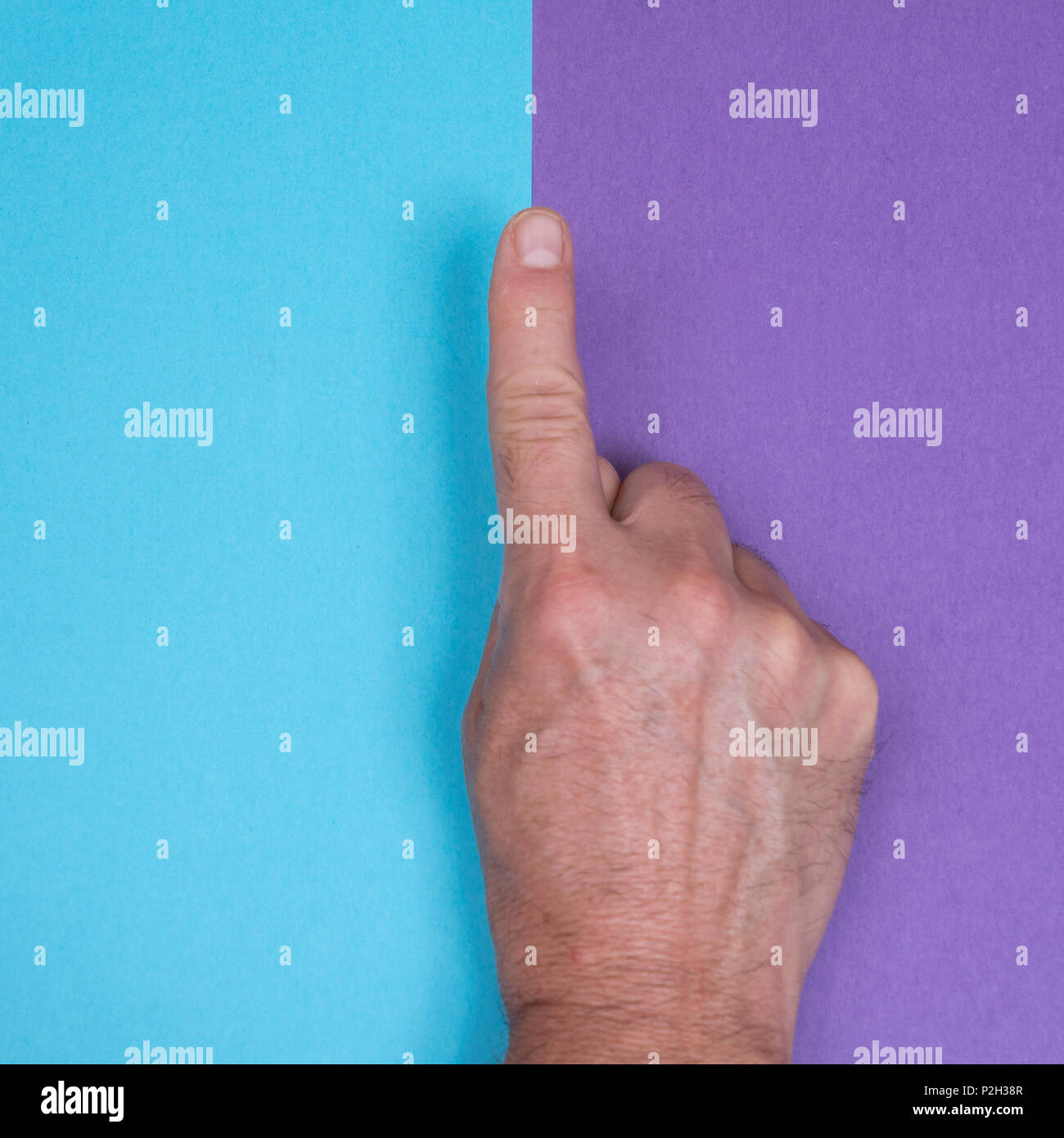 a hand on a two-color surface Stock Photo - Alamy