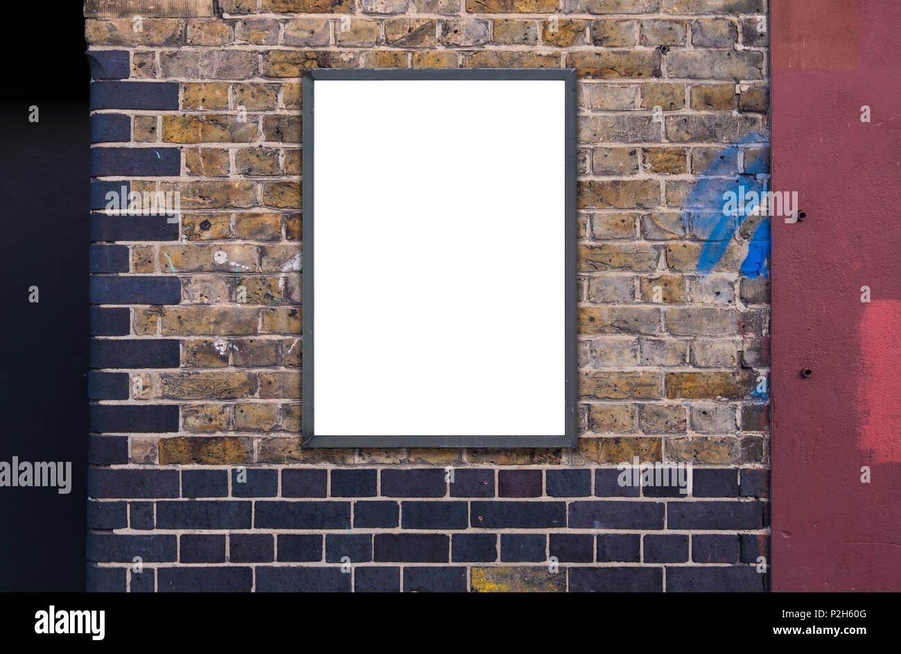 Blank advertising A1 poster billboard on brick wall Stock Photo