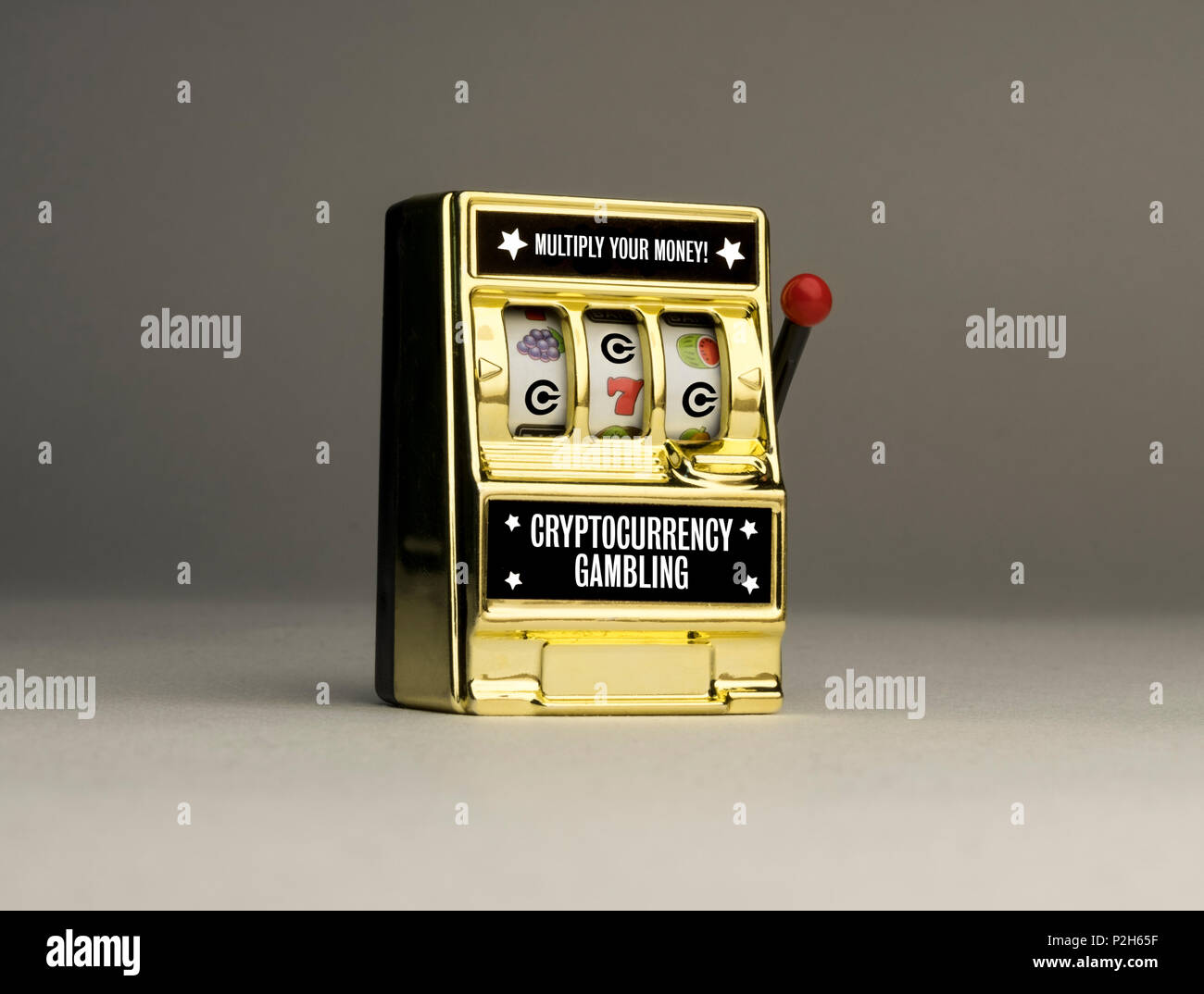 Conceptual casino slot machine to emphasise the reality of cryptocurrency gambling risks, one armed bandit Stock Photo