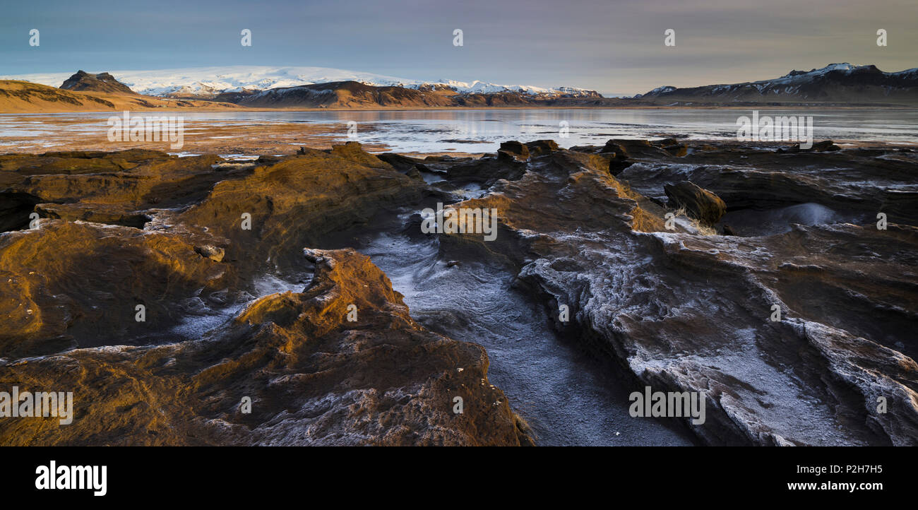Rock formations in the Dyrholaos bay, Dyrholar, South Island, Island Stock Photo