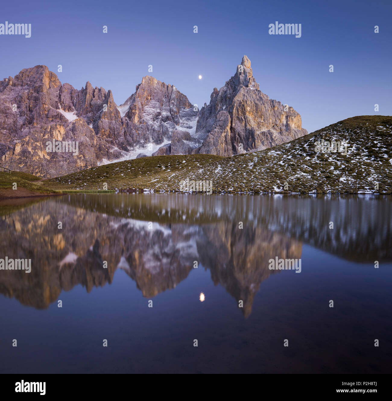 Cima Bureloni 3130m, Cima della Vezzana 3192m, Cimon della Pala 3184m, during moonrise with reflection in a mountain lake, Laghe Stock Photo