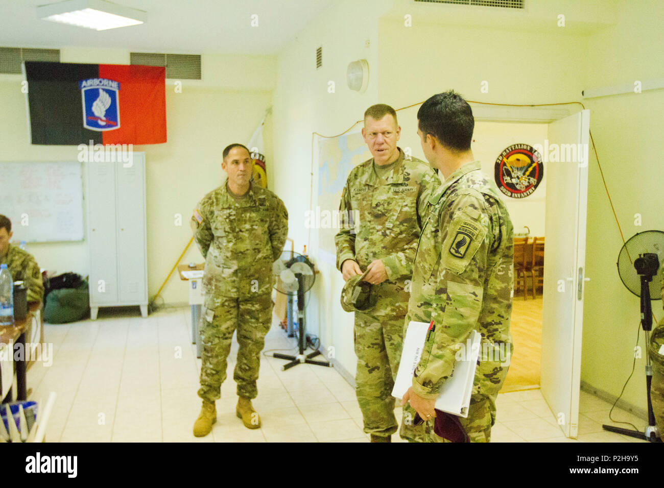 Brig. Gen. Kenneth L. Kamper, Deputy Commanding General of the 4th Infantry Division, who leads the Mission Command Element for Atlantic Resolve, speaks with Maj. Paul Deleon, 2nd Battalion, 503rd Infantry Regiment Battalion Executive Officer, and Maj. Brian Miletich, S3 Operations Officer, at Camp Adazi, Latvia September 25, 2016. The U.S. Army Soldiers involved in the visit, are training with their Baltic allies in support of Operation Atlantic Resolve, a U.S. led effort being conducted in Eastern Europe to demonstrate U.S. commitment to the collective security of NATO and dedication to endu Stock Photo