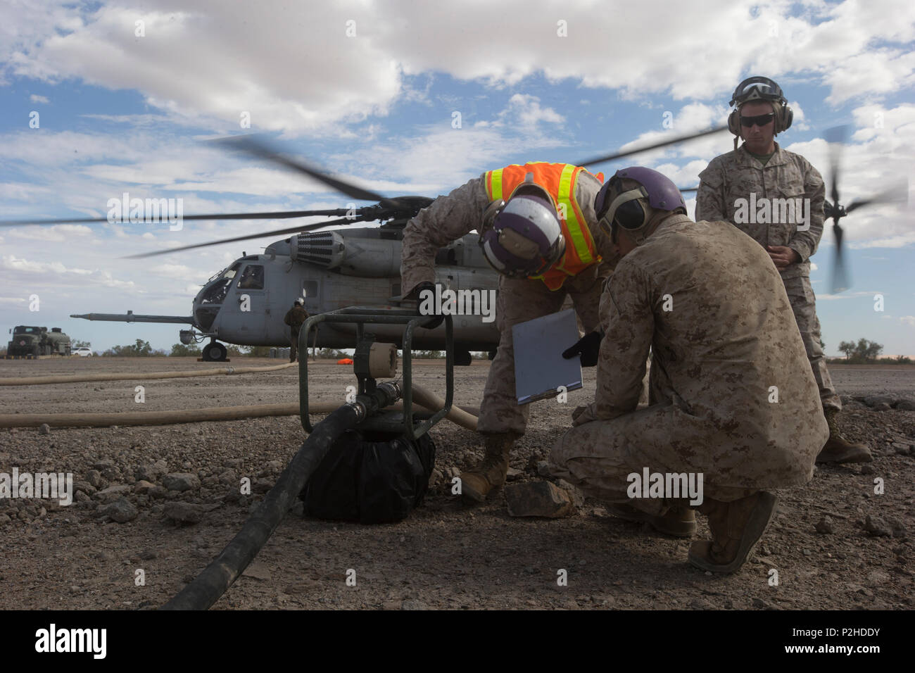 U.S. Marines assigned to Marine Aviation Weapons and Tactics Squadron One (MAWTS-1) refuel a CH-53E Super Stallion at a forward arming refueling point in support of Weapons and Tactics Instructor (WTI) course 1-17 at LZ Bull Assault, Calif., Sept. 27, 2016. This exercise was a part of WTI, a seven week training event, hosted by MAWTS-1 cadre, which emphasizes operational integration of the six functions of Marine Corps aviation in support of a Marine Air Ground Task Force. MAWTS-1 provides standardized advanced tactical training and certification of unit instructor qualifications to support Ma Stock Photo