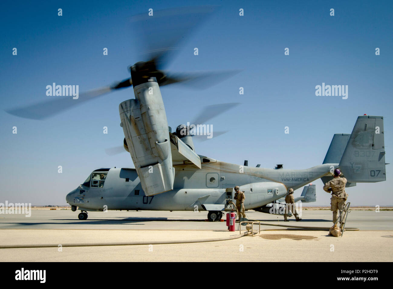 U.S. Marines with Marine Wing Support Squadron 373, Special Purpose Marine Air-Ground Task Force - Crisis Response - Central Command, fuel an MV-22 Osprey at a forward arming and refueling point during a Mission Rehearsal Exercise at a base in southern Jordan, Sept. 10, 2016. The MRX is a collective training event where the MAGTF elements collaborate to refine individual and cooperative capabilities. U.S. Marines and Sailors assigned to Special Purpose Marine Air-Ground Task Force-Crisis Response-Central Command support operations, contingencies and security cooperation in Marine Corps Forces  Stock Photo