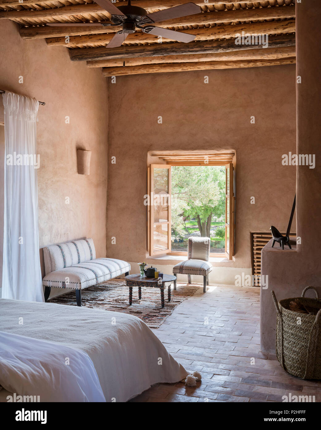 Old Moroccan Tea Table In Seating Area In Bedroom With Earth