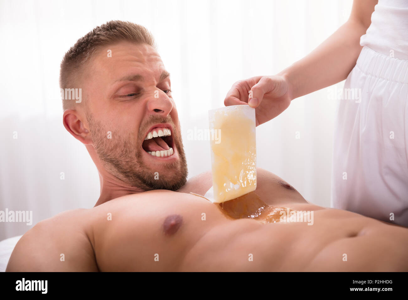 Close Up Of Beautician S Hand Waxing Man S Chest In Spa Stock Photo Alamy